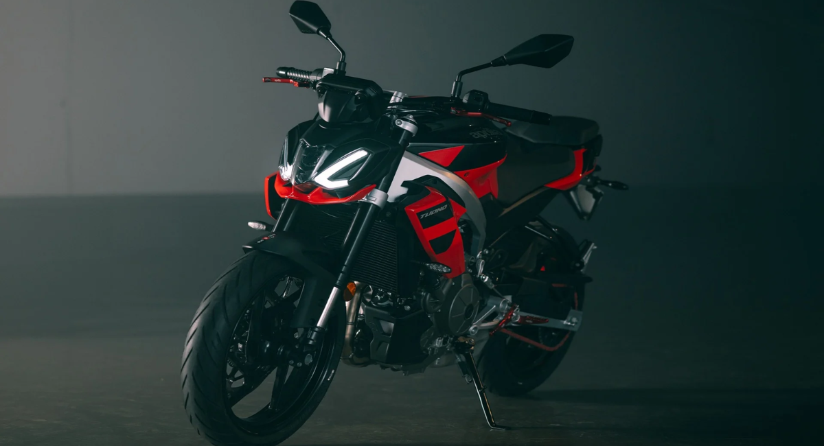 Red and black Aprilia Tuono 457 photographed in a dark studio