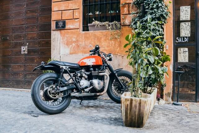 motorcycle standing in shade