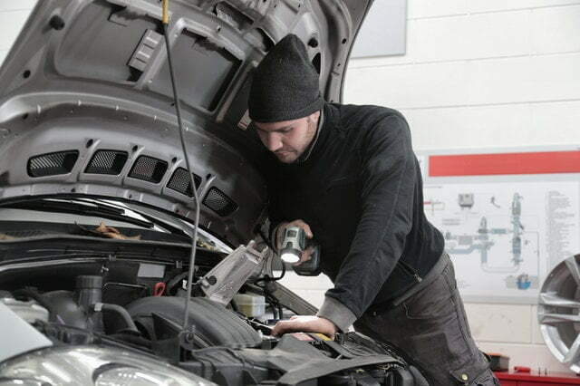 Mechanic repairing electric car in india