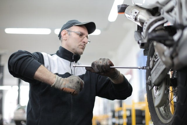 mechanic doing bike modification