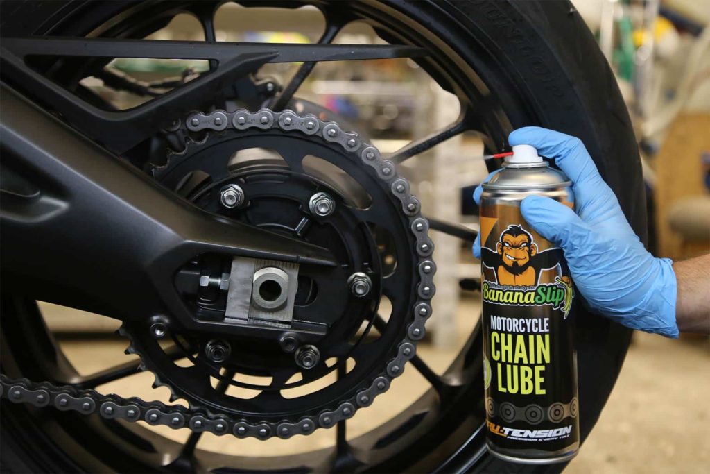 Mechanic Lucubrating motorcycle chain 