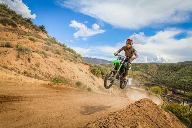 biker doing a stunt in mountain bike