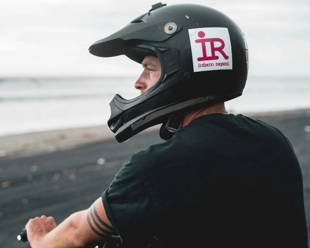 biker wearing a helmet and watching the view